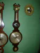 A Mahogany banjo style mercury Barometer by Silvester, Bromwich, 42 3/4'' tall overall.