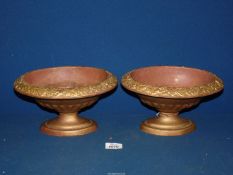 A pair of cast iron oval Jardinieres with raised leaf decoration to rim, 9" long x 5 1/2" tall.