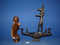 An Egyptian replica of standing Anubis possibly made in ebony wood,