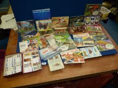 A large box of Brooke Bond albums (48) and some loose tea cards.