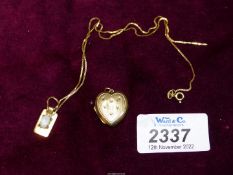 A gold plated heart shaped locket and a small 9ct rectangular shaped pendant set with a small opal,