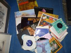 A box of LP's and 45's including Johnny Cash, Don Williams, Blacklace, Ottawan, Cat Miller etc.