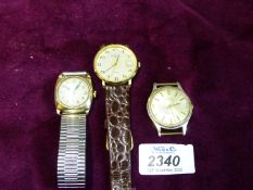 Three gentlemen's watches including one in gold with Jan 1945 inscription verso, all a/f.