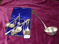 A quantity of miscellaneous teaspoons, sugar sifters, pickle fork and a serving ladle.