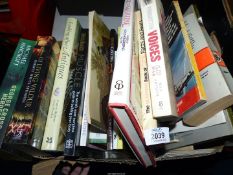 A box of books including Forgotten Voices of The Great War, The Animal Wound,
