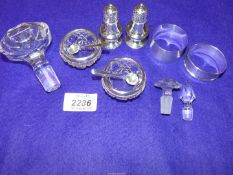 A quantity of small silver items including napkin rings, silver rimmed salts and spoons,