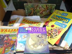 A box of comics Valiant and The Dandy, Beano annuals and Harry Potter.