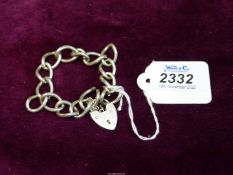 A large link silver Bracelet with heart shaped padlock clasp, 33 grams.