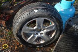 A Mohawk 205/65 R16 tyre (as new) and five stud wheel.