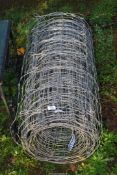A part roll of sheep netting.