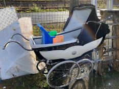 A large old pram and a child's seat.