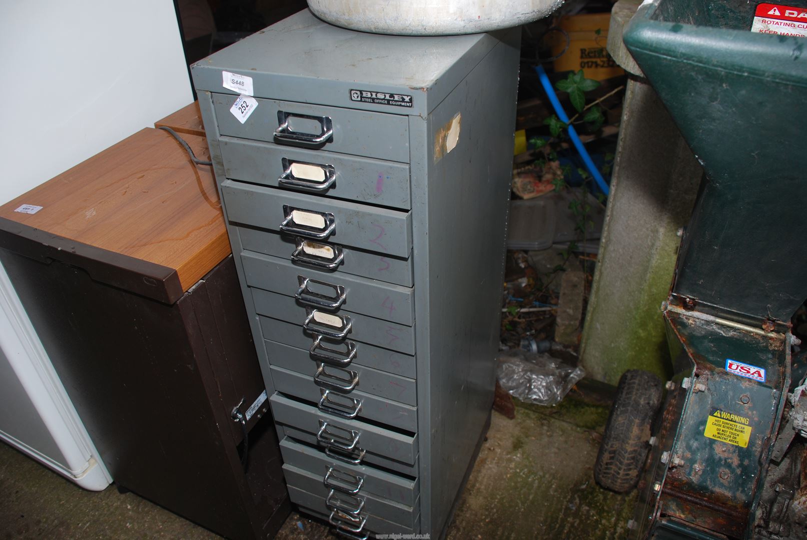 A Bisley slim metal filing cabinet with 15 drawers.