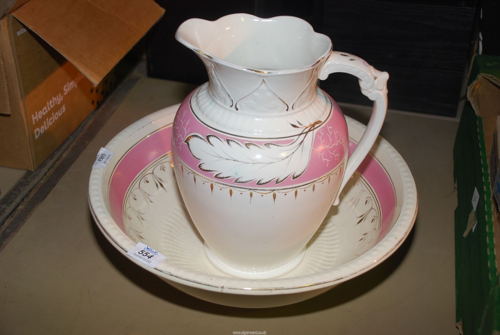 A pink/cream bedroom wash bowl and jug a/f.