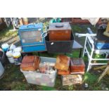 A quantity of animal cages and boxes with feeders and drinkers.