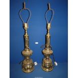 A pair of cast metal brass finished Table Lamps with reeded column tops and acanthus leaf