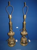 A pair of cast metal brass finished Table Lamps with reeded column tops and acanthus leaf