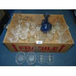 A quantity of glasses including Edinburgh and Stuart Crystal, champagne flutes and blue glass jug.