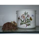 A Portmeirion plant pot and Spaghetti pottery Highland Cow figure.