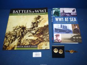 A South Wales Borders cuff links and tie pin set and two books 'WWI at Sea' (published 2007) and