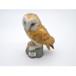 A porcelain model of a Barn Owl, 8'' high, by Leonardo Collection.
