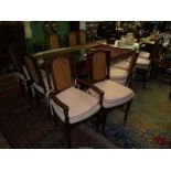 A contemporary set of 12 dining Chairs including two carvers,