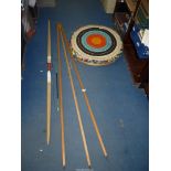 An Archery target, bow (a/f) and two arrows.