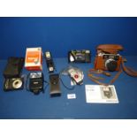 A Yashica 35w camera with case and a quantity of electronic flash units.