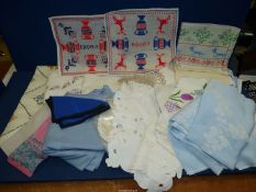 A quantity of linen including embroidered napkins, crochet and lace work, tablecloths etc.