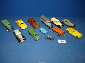 A quantity of Dinky Toy cars and vehicles including Ford Sedan, Packard, Sunbeam Talbot,