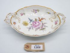 A fine Nymphenburg two handled dessert Dish of rococo style hand painted with flowers,