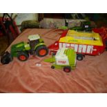 A Claas Atlas 936-RZ toy tractor with a John Deere front end loader, 18'' long x 8'' high,