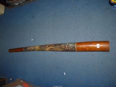 A wooden Didgeridoo.