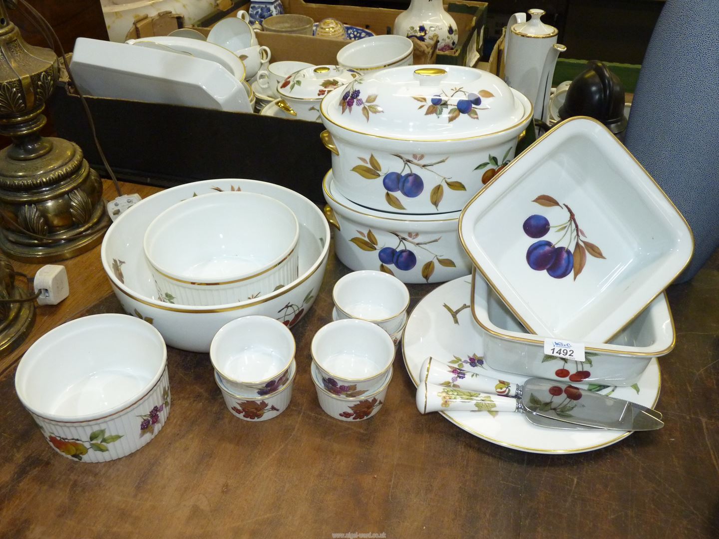 A quantity of Royal Worcester 'Evesham' including lidded tureens, ramekins, cake plate and slices,