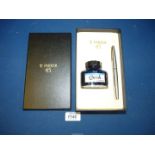 A Parker 45 pen box with bottle of ink and Parker cartridge ink pen.