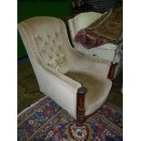 An elegant circa 1900 buttoned back deep-seated low Armchair,