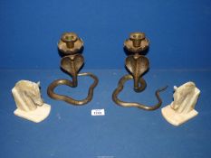 A pair of Indian brass Cobra candle holders, 8'' tall and a pair of Onyx horse bookends, 5'' tall.