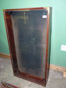 A large table top wooden Display case with brass coloured corners,