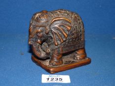 A finely carved small Elephant in ceremonial livery,