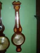 A mercury Banjo barometer having a marquetry shell with flower detail, crack to glass, 39" long.