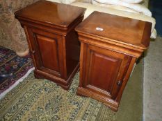 A pair of opposing doored Bedside Cabinets believed to be cherrywood,