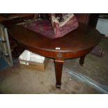 A Mahogany Dining Table standing on canted, fluted, tapering square legs,