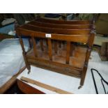A contemporary Mahogany Canterbury having a wide lower drawer and three divided compartments,