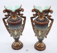 A pair of Majolica vases, (one with damage to base), 16" tall,