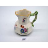 A Dillwyn Swansea pottery jug of octagonal form colourfully decorated with stylised flowers and