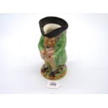 A Victorian Staffordshire figural toby jug: the snuff taker; part of hat re- glued.