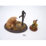A 'Country Artists' figure of a Pig with water pump and a Border Fine Arts studio Wren with nest by