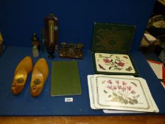 Two sets of Portmeirion placemats, small bottles, thermometer, small scales, flower book,