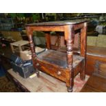 A stained Pine and other woods Occasional Table having a lower shelf with a frieze drawer having