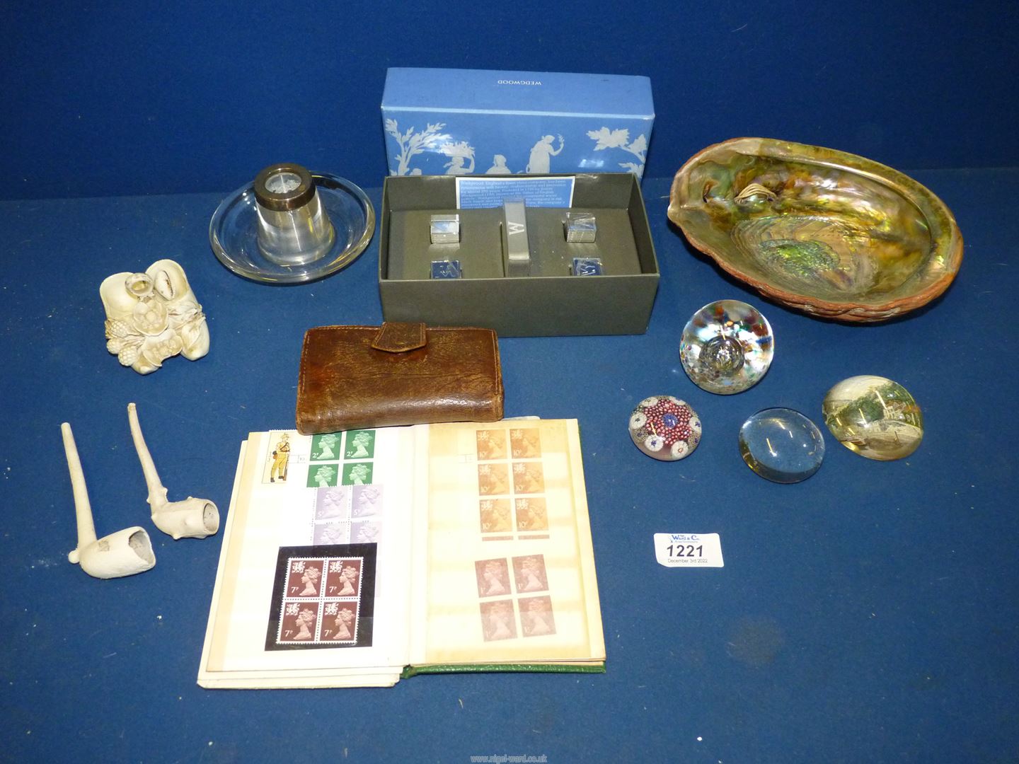A quantity of miscellanea including Abalone shell, small book of mint and used British stamps,