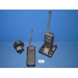 Two Motorola Radius GP300 walkie talkies with battery charger.
